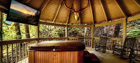 Bask in bubbling bliss in your very own private, covered hot tub!