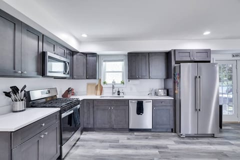 Large, modern kitchen equipped with all the essentials for your cooking needs