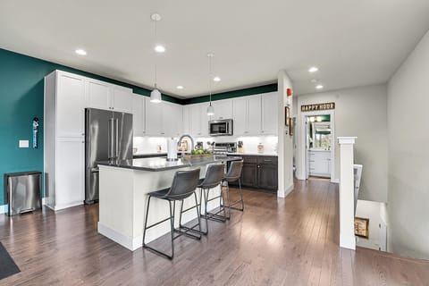 Large kitchen with working area and seating at the island #2