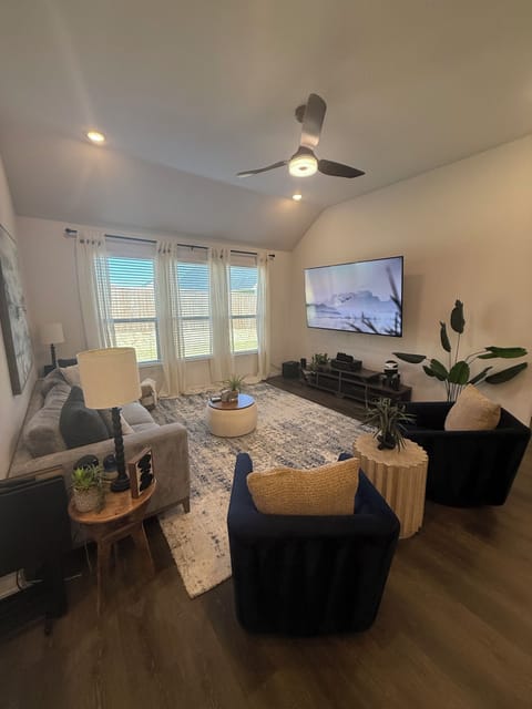 Living room with 85" TV, room for additional air queen sized mattress if needed