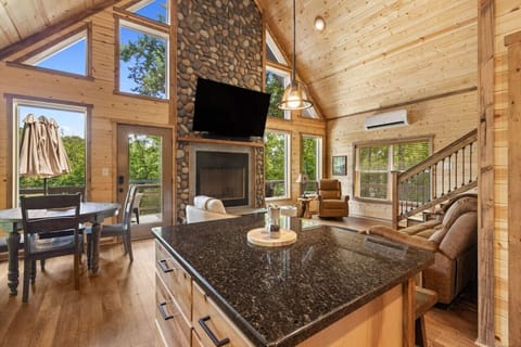 Enjoy the seamless flow of our open-concept living area, where the kitchen and dining spaces effortlessly connect with the inviting living room.