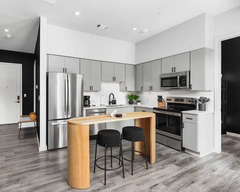 Lots of natural light pouring into this fully equipped kitchen. Seating for two at the island. We provide all the utensils you might need to enjoy a meal at home.