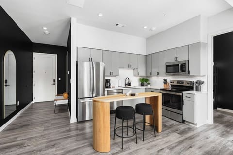 Lots of natural light pouring into this fully equipped kitchen. Seating for two at the island. We provide all the utensils you might need to enjoy a meal at home.