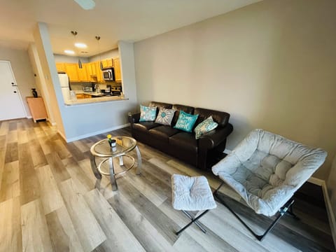 Enjoy a fully furnished living space with a sofa, coffee table, TV stand, and dining table—designed for comfort and convenience.
