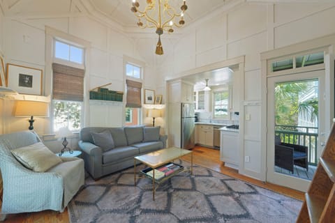 LIVING ROOM VIEW TO KITCHEN & PRIVATE BALCONY