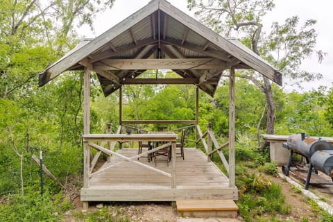 Relax under the pergola with seating for 8 and stunning San Marcos River views