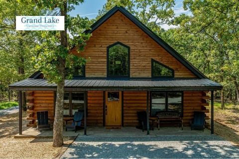 New construction log cabin, has a great porch to welcome visitors. 