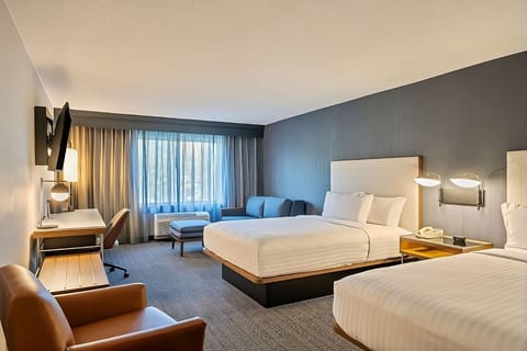 Unwind in a spacious room with two plush beds.