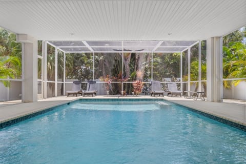 Covered patio perfect for unwinding by the luxury saltwater pool