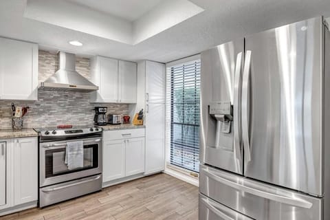 - Spacious kitchen includes a French door fridge, large oven, and bright window bringing in natural light
- Modern layout with easy access to cooking tools and counter space
- Everything you need is ready for your culinary adventures