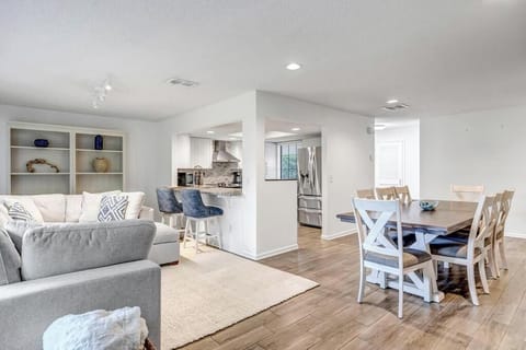 - Open concept living and dining area offers seating, bar stools, and soft neutral décor
- Connect with friends or family from the kitchen to the couch without missing a moment
- Functional flow makes it great for both short and extended stays