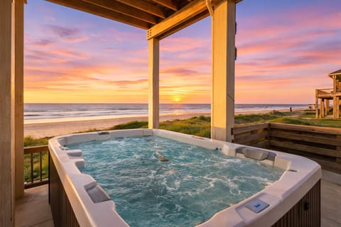 Private beachfront hot tub with unobstructed Gulf views, ideal for sunset relaxation and luxury coastal living.