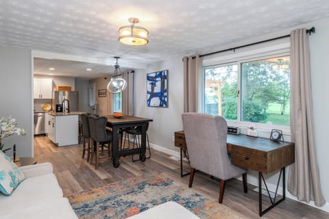 Located next to the kitchen, ensuring easy access to food and drinks.