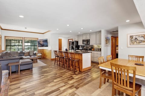 Fully equipped cabin kitchen with ample cabinetry, stove, fridge, microwave, and coffee maker—perfect for cooking meals, morning coffee, and feeling right at home on your stay.