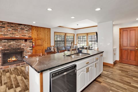 Fully equipped cabin kitchen with ample cabinetry, stove, fridge, microwave, and coffee maker—perfect for cooking meals, morning coffee, and feeling right at home on your stay.