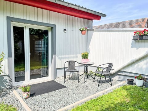 Shrub, Garden, Flowerpot, Door, Yard, Houseplant, Siding, Backyard, Chair, Landscaping