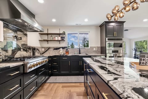 Fully-equipped kitchen featuring high-end appliances, perfect for preparing gourmet meals.