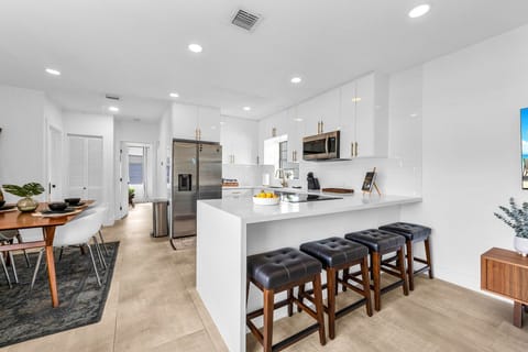 Dining table for 4, with 4 additional counter stools at the counter