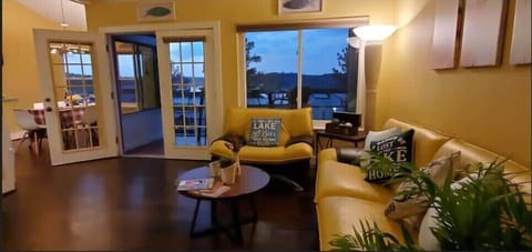 Living room with leather sofa and couch, over looking Lake Livingston.