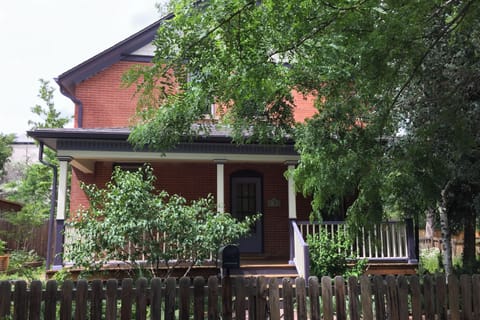 Many trees and flowers on property.
