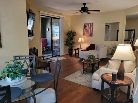 Spacious open living and dining area with entrance to the private patio