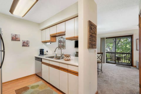 Head into the open kitchen, offering ample storage space & lots of amenities