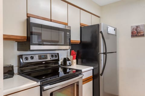 Head into the open kitchen, offering ample storage space & lots of amenities