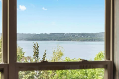 Bedroom 1 with king bed, balcony access, Smart TV, and en-suite