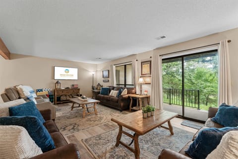 Cozy and spacious living area with TV