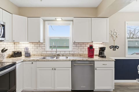The spacious eat-in kitchen is well equipped with all the comforts of home