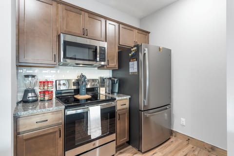 The sophisticated kitchen offers ample space & all the comforts of home