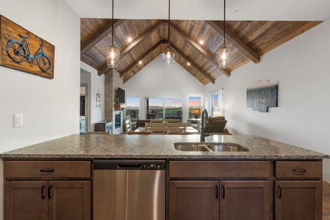 The sophisticated kitchen offers ample space & all the comforts of home