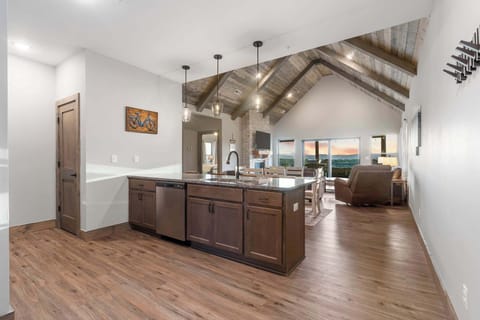 The sophisticated kitchen offers ample space & all the comforts of home