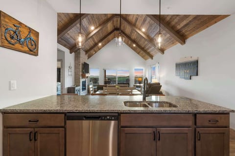 The sophisticated kitchen offers ample space & all the comforts of home