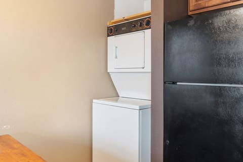 Private laundry is available for your stay, tucked away in the kitchen