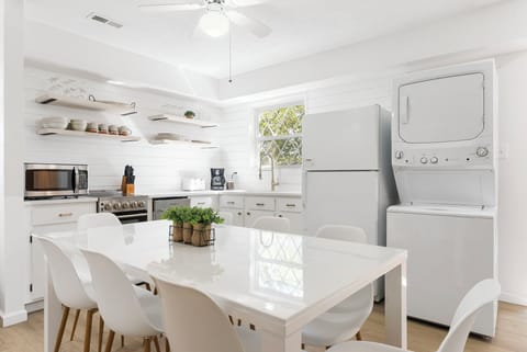 The elegant kitchen offers ample space & all the comforts of home