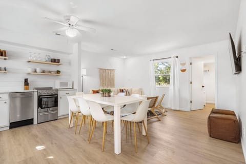 Gather for meals in the open dining area, offering seating for 8