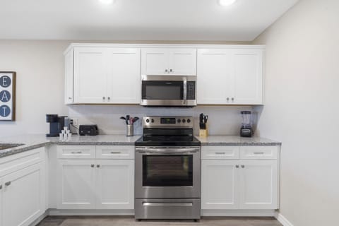Full kitchen stocked with a blender, coffee maker, toaster and more!