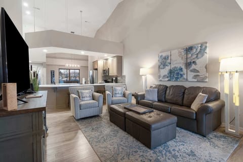 Modern spacious living area with TV