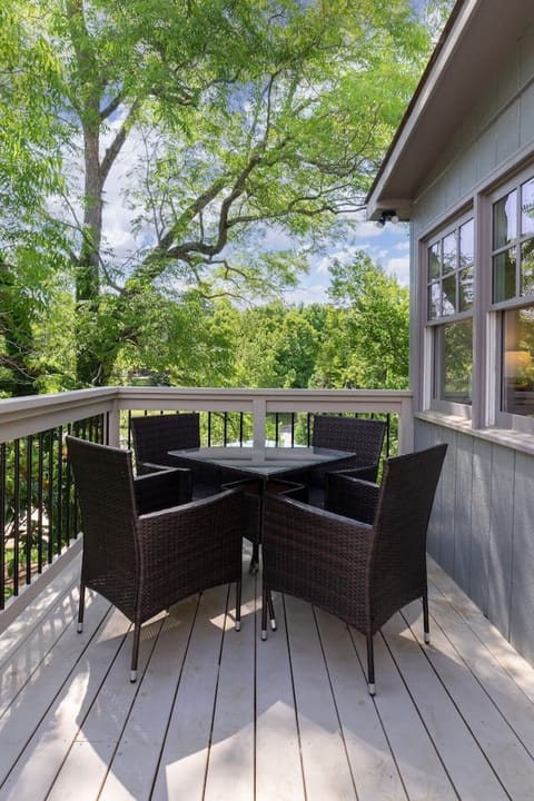 Take full advantage of the fresh air! Dine outside on the spacious private deck, offering a tranquil and secluded outdoor living space.