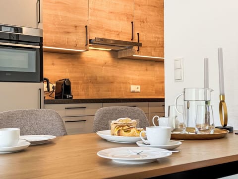 Tableware, Furniture, Table, Dishware, Cabinetry, Drinkware, Countertop, Kitchen, Wood, Plate