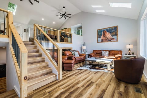 Luxurious Mid-Level living room with a 20-ft ceiling