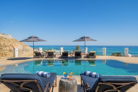 Sunny poolside patio overlooking an incredible ocean view
