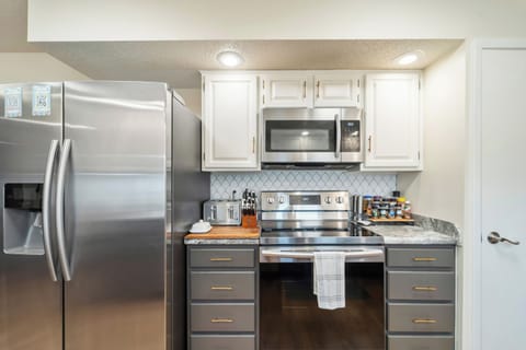 Stainless steel electric appliances with some spices, herbs, and cooking oils to get you started.