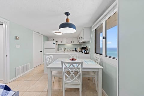 View of dining area and kitchen from the living room