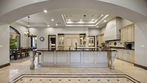 Elegant kitchen with a spacious island, dual sinks, and high-end finishes.