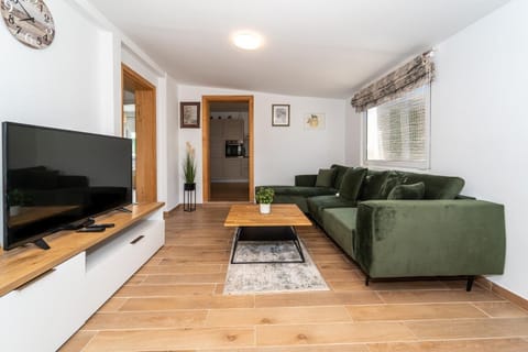 Living room with sofas, WiFi internet, and satellite TV