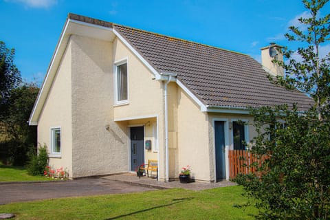 Well maintained garden, flowers and shrubs, outside seating. Dunmore Villas Holiday Home No 1 - seaside family-friendly holiday home in Dunmore East, Co. Waterford, Ireland