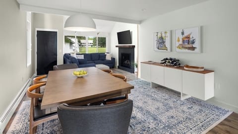 Spacious open-concept living area with dining table that seats 6.