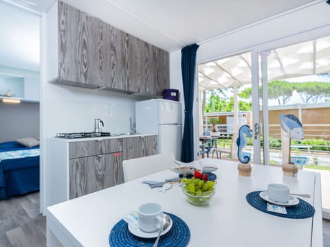 Table, Furniture, Cabinetry, Tableware, Blue, Countertop, Dishware, Kitchen, Interior Design, Living Room